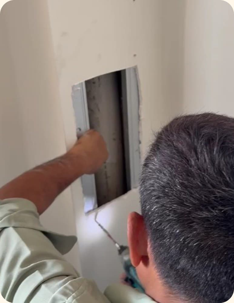 Skim-coating a wall with a trowel